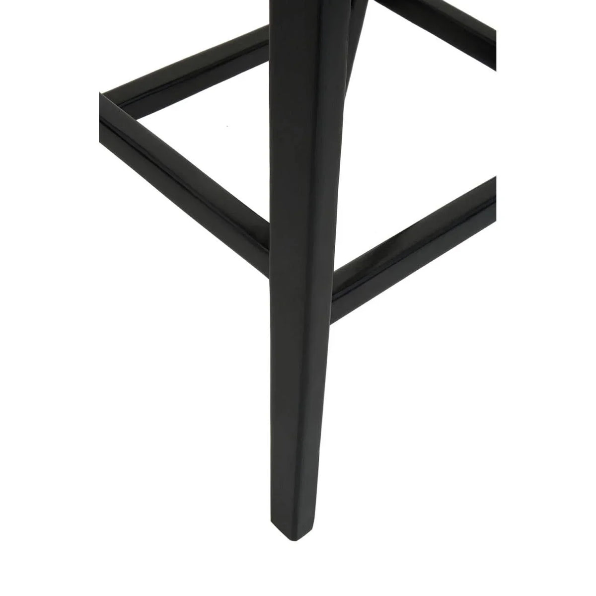 Black metal furniture leg with support bar, close-up view of modern stool base