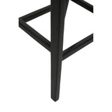 Black metal furniture leg with support bar, close-up view of modern stool base