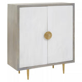 Cream and grey two-door cabinet made of mango wood, featuring a sleek design with a round gold handle and tapered gold legs. The cabinet has a smooth finish and a modern aesthetic, suitable for various interior styles