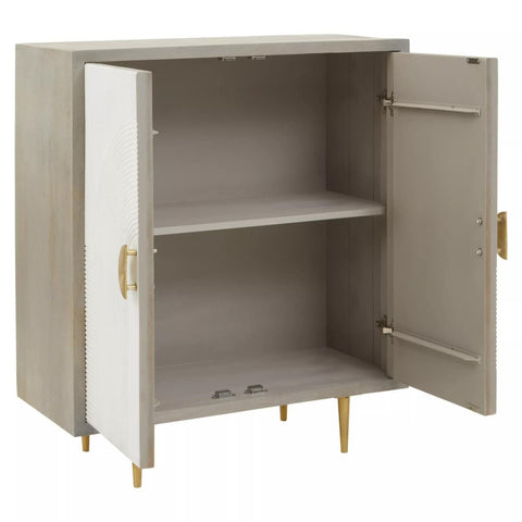 Cream and grey two-door cabinet made from mango wood, featuring a smooth finish, two doors with gold handles, and an open interior with one shelf. The cabinet stands on four gold legs, adding a modern touch to the design