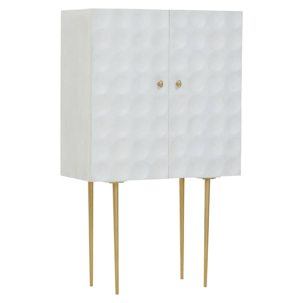 Cream finish two-door cabinet made of mango wood, featuring a textured geometric pattern on the front, supported by four slender gold legs. The cabinet has two round gold knobs for easy access to the storage space inside