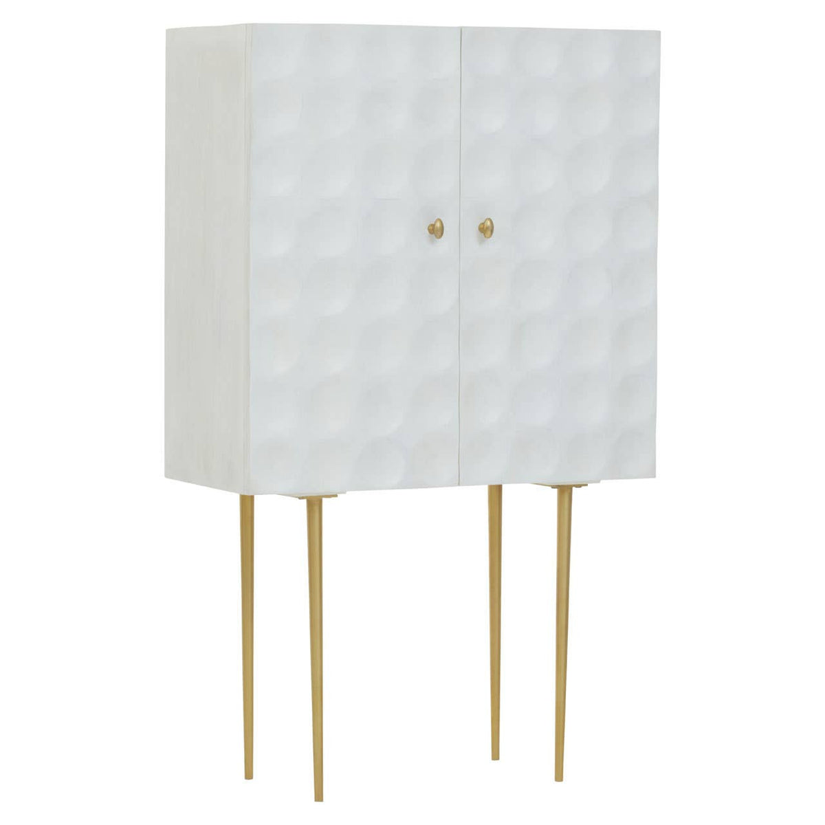Cream finish two-door cabinet made of mango wood, featuring a textured geometric pattern on the front, supported by four slender gold legs. The cabinet has two round gold knobs for easy access to the storage space inside