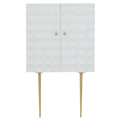 Cream finish two-door cabinet made from mango wood, featuring a textured front with a geometric pattern, gold knobs, and slender gold legs for support