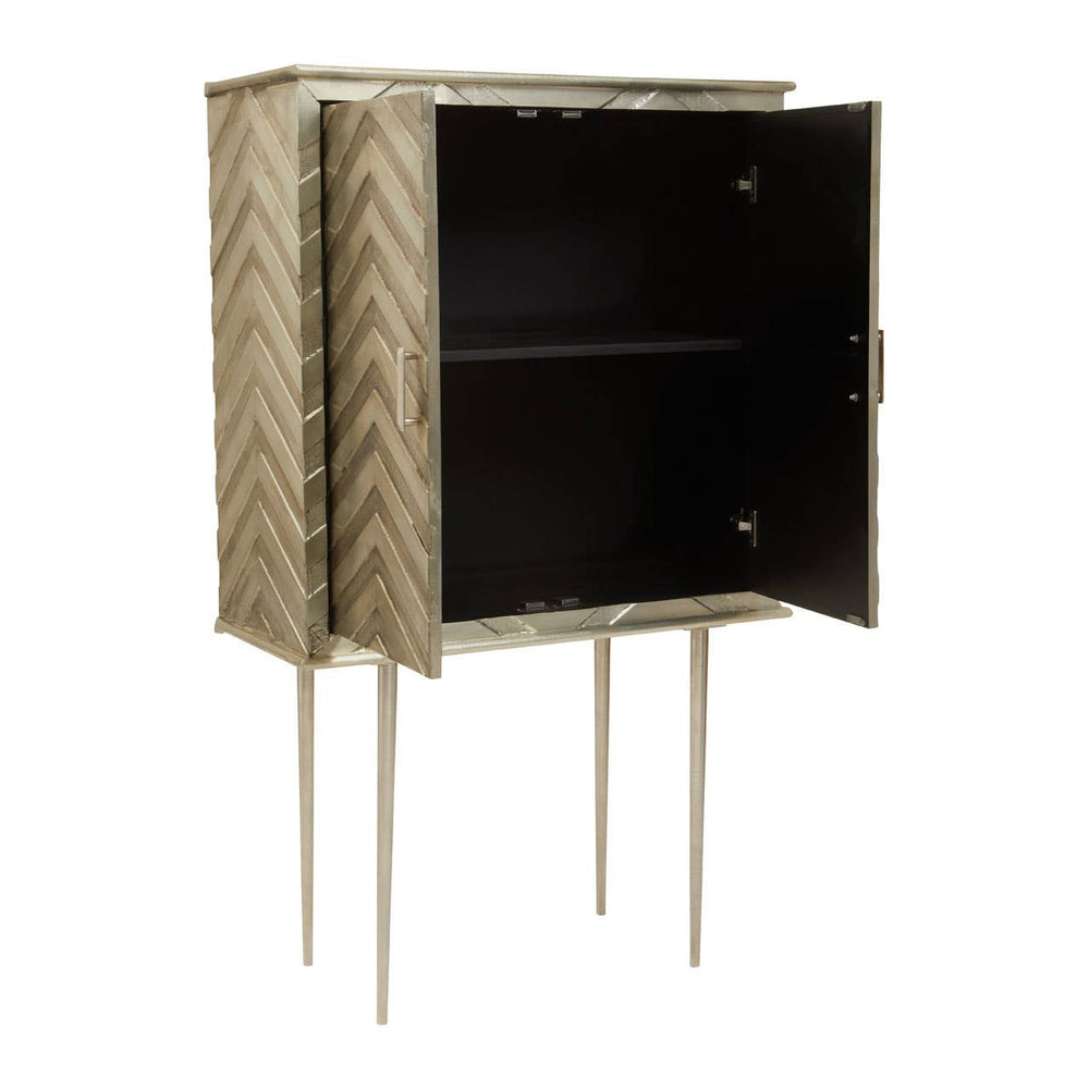 Two-door cabinet with a herringbone pattern on the exterior, featuring a black interior and supported by slender gold legs. The cabinet doors are slightly ajar, revealing a spacious shelf inside