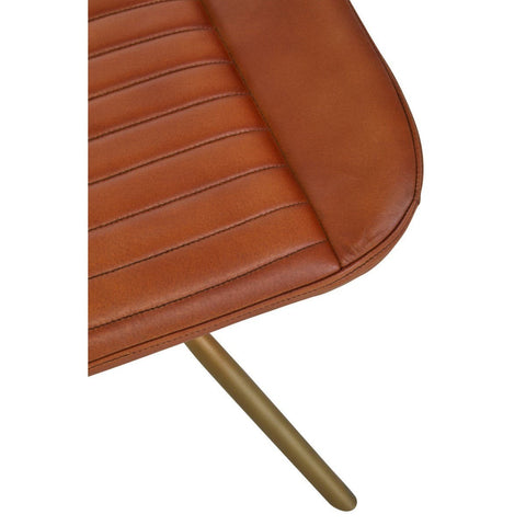 Buffalo tan leather footstool featuring a smooth, rounded top with subtle stitching details and a sleek, gold-colored metal leg. The warm tan color of the leather adds a cozy touch, while the minimalist design complements modern home decor