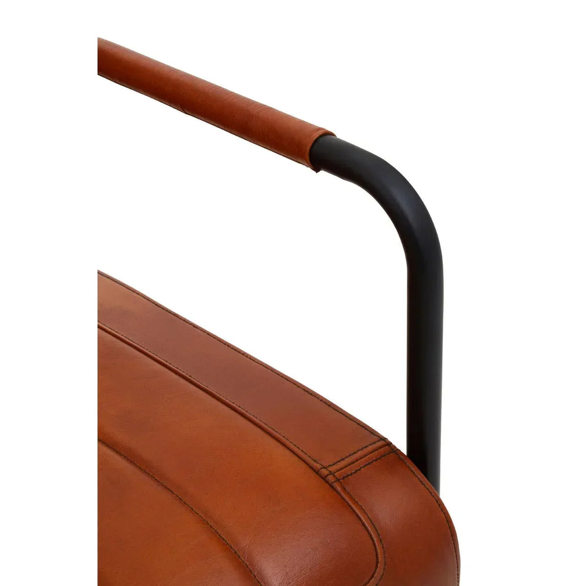 Brown leather dining chair with black metal armrest, close-up of seat and stitching detail