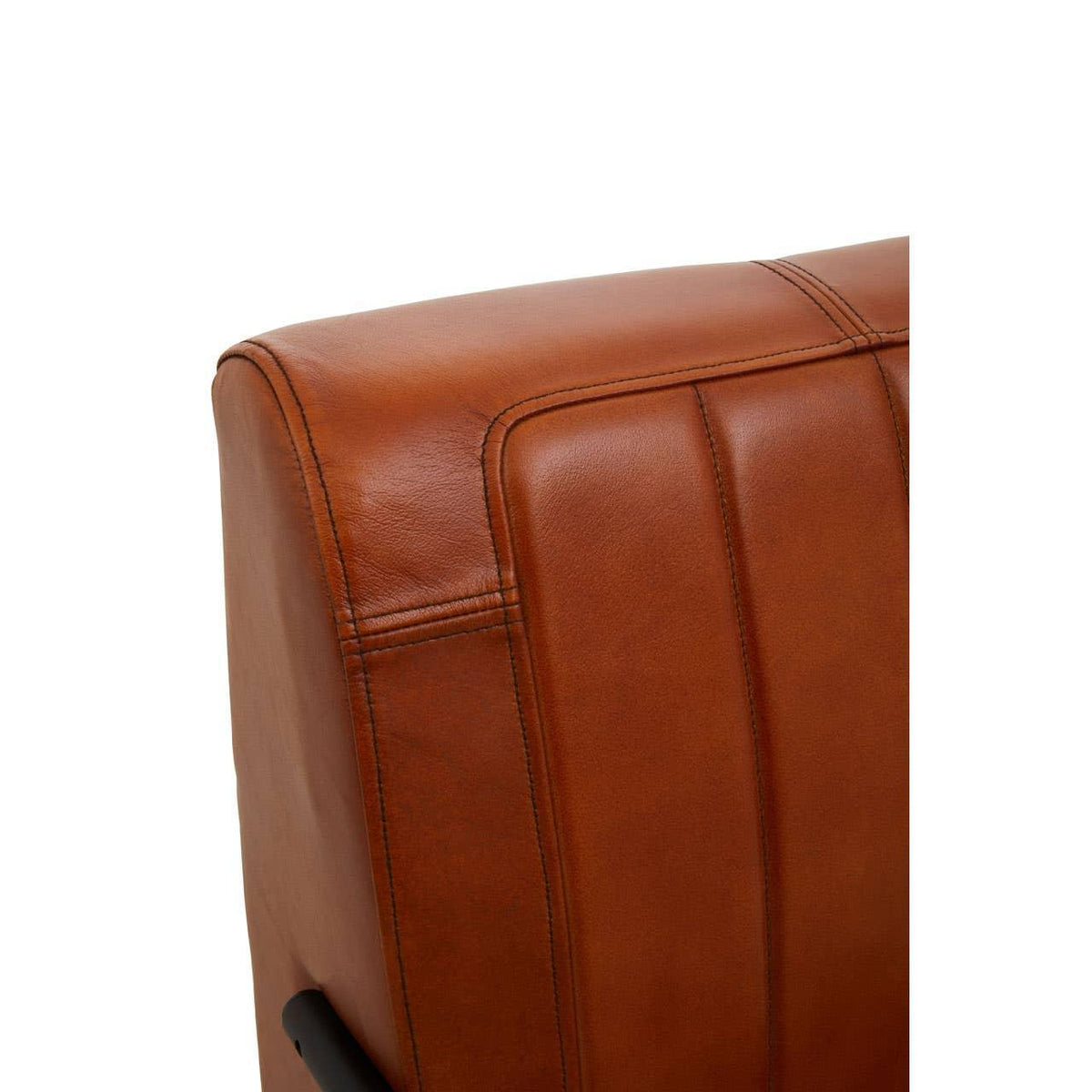 Closeup of brown leather sofa backrest with stitched panel detailing