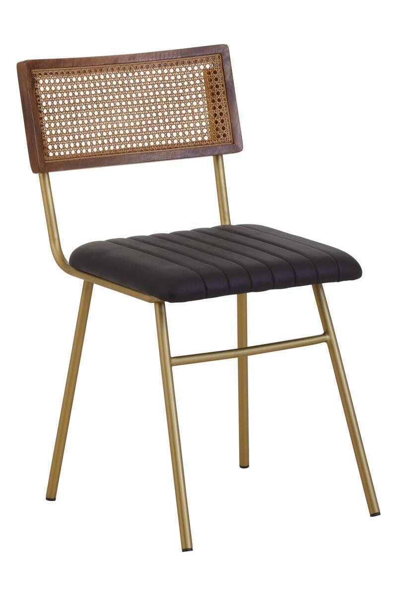 Dining chair with brown cane backrest, black padded seat, and gold metal legs