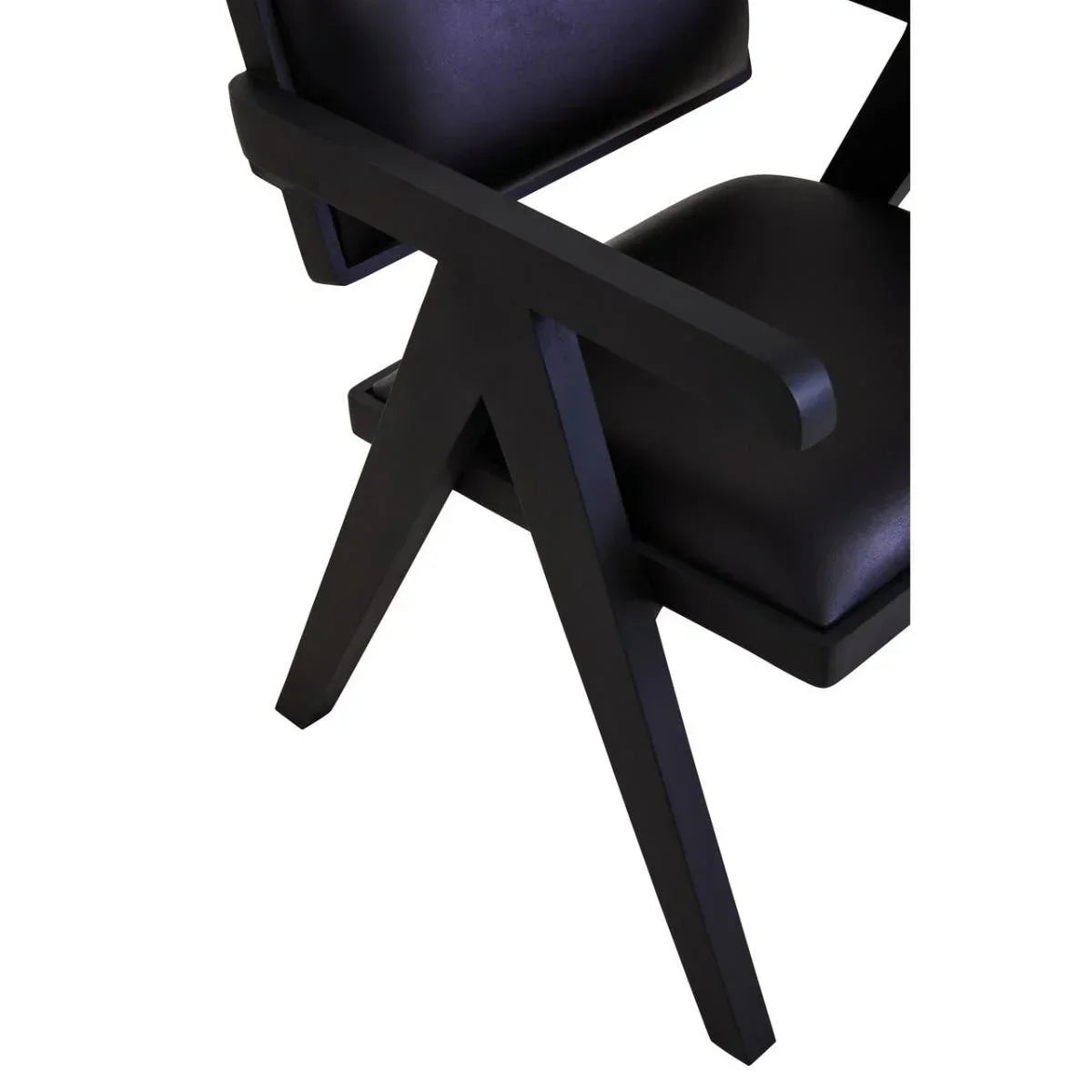 Close-up of black dining chair with padded seat, angled wooden legs and armrest detail