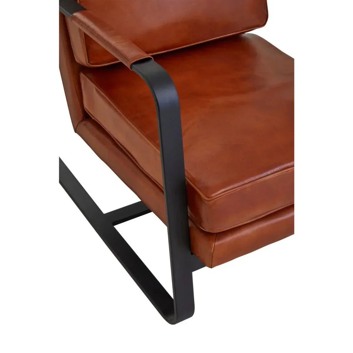 Brown leather armchair with black metal frame and cushioned seat close-up