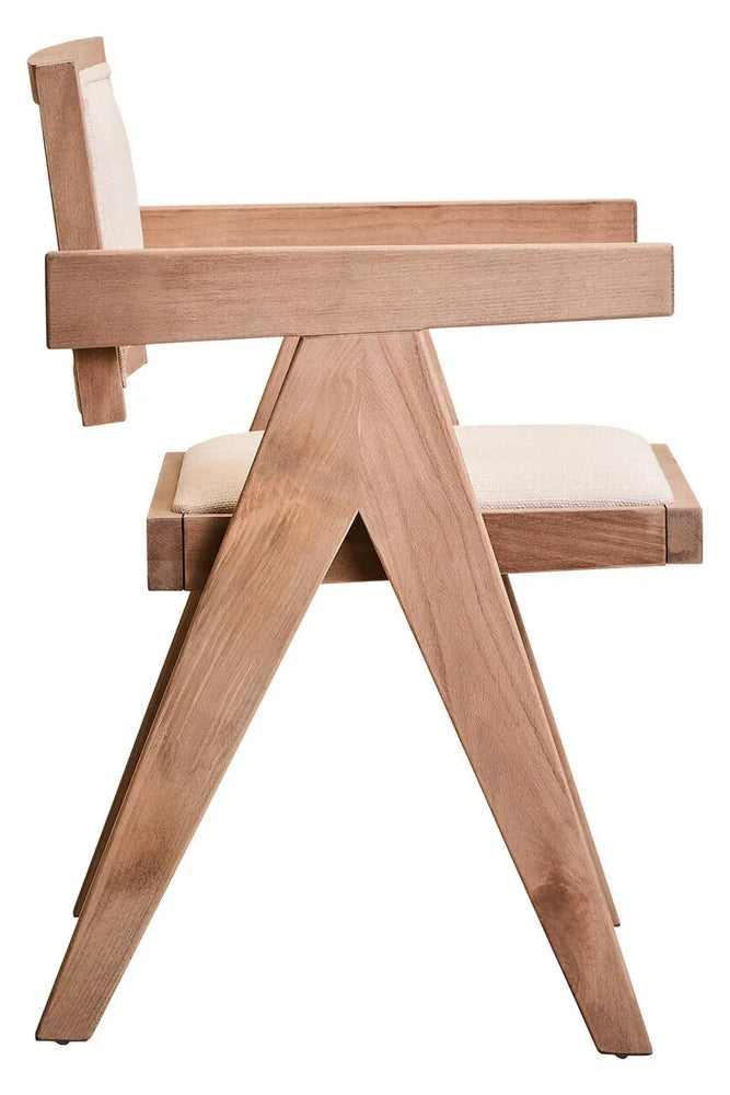 Side view of wooden dining chair with beige upholstered seat and backrest