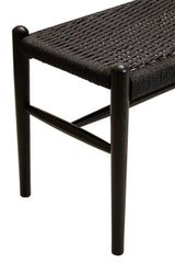 Black woven bench seat with dark wooden frame, close-up on corner and legs