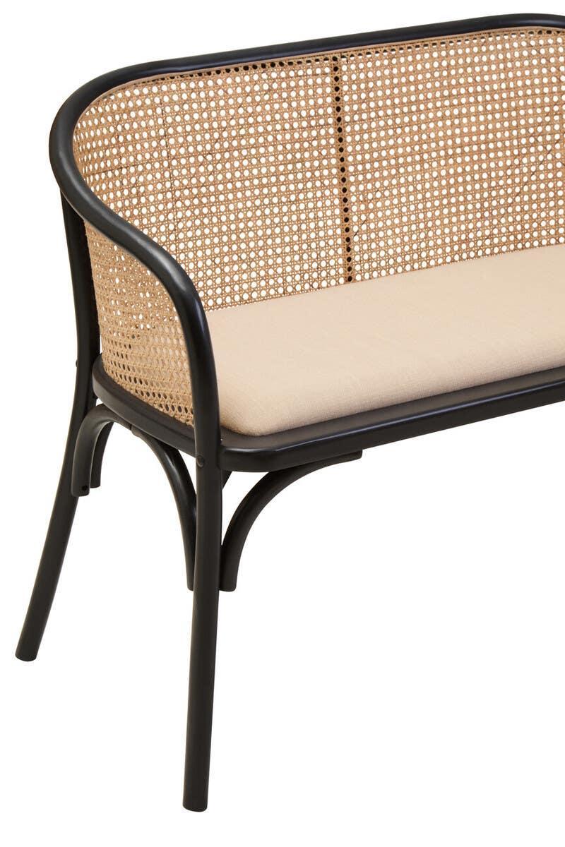 Rattan bench with black frame and beige cushion, close view of seat and curved backrest