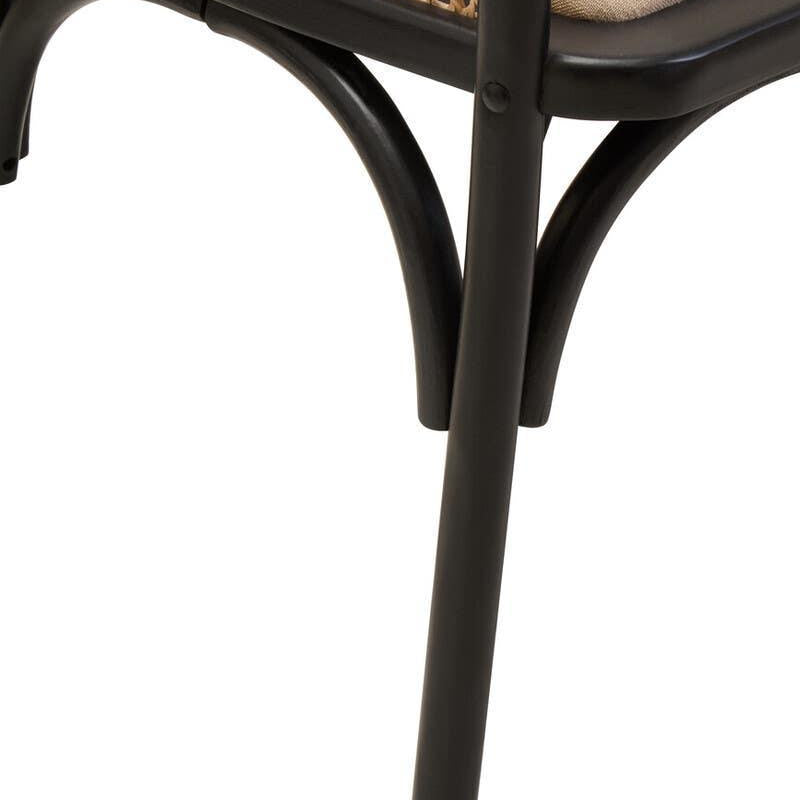 Close view rattan dining chair with black metal legs and beige cushion