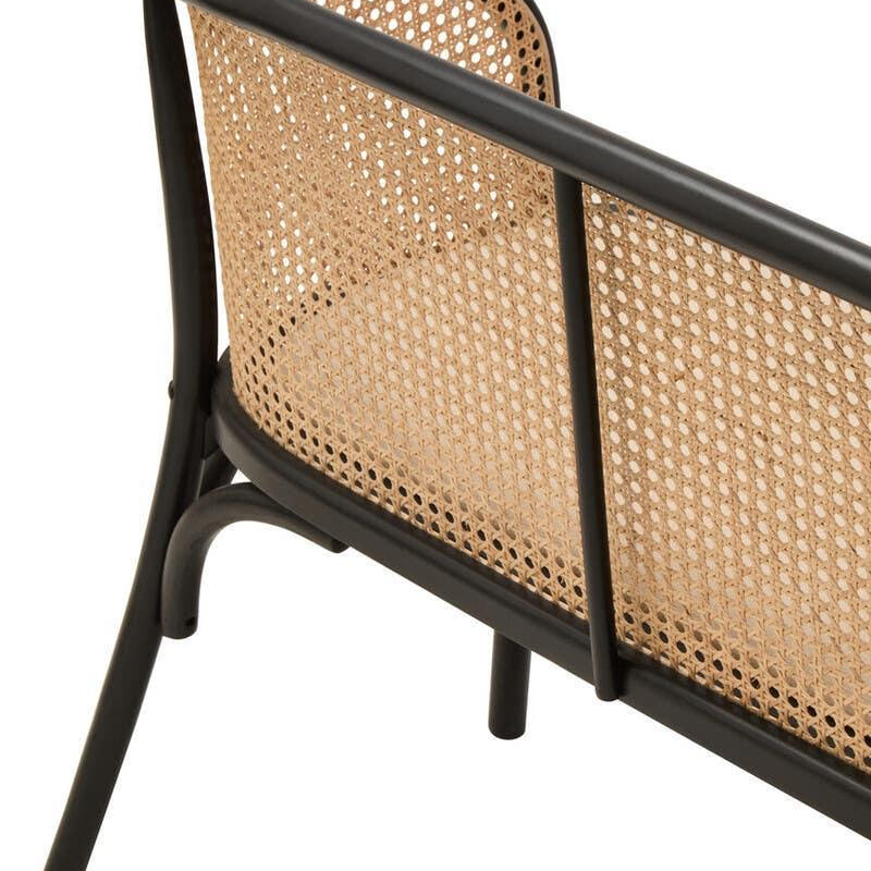 Rattan backrest chair with black frame and woven cane detailing, shown from angled side view
