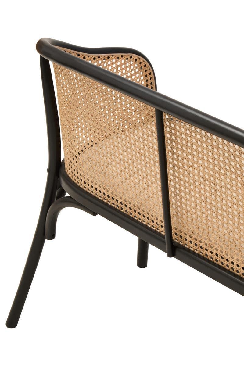Rattan backrest chair with black frame and woven cane detailing, shown from angled side view