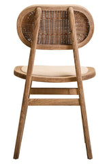 Back view of wooden dining chair with woven rattan backrest and cushioned seat