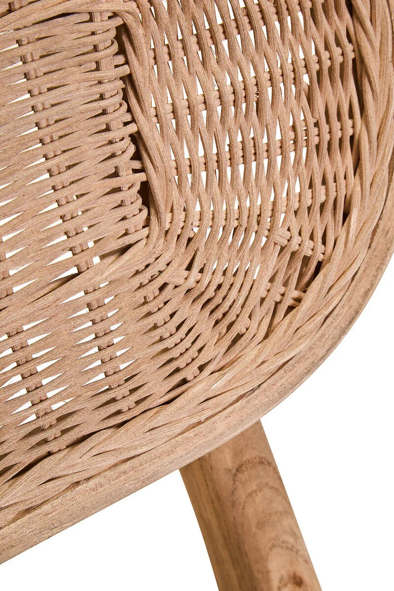 Closeup of natural rattan chair backrest with woven pattern and wooden frame detail