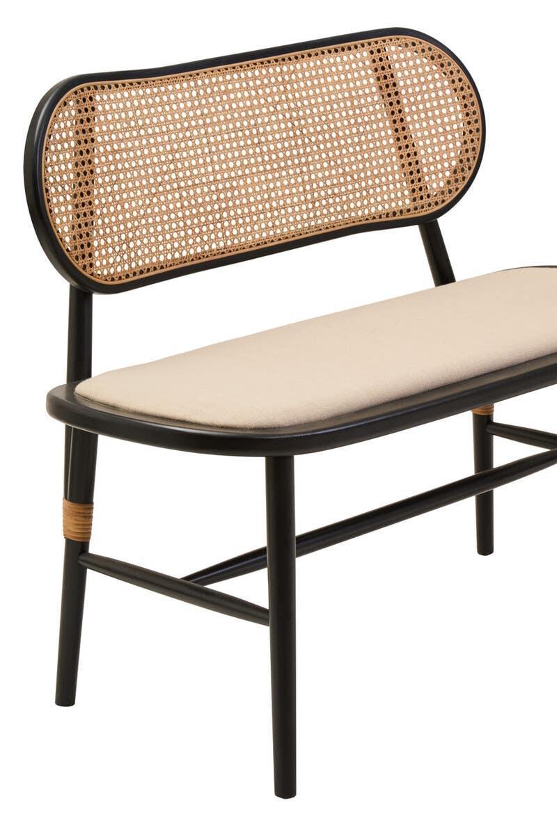 Black frame bench with rattan backrest and beige cushioned seat