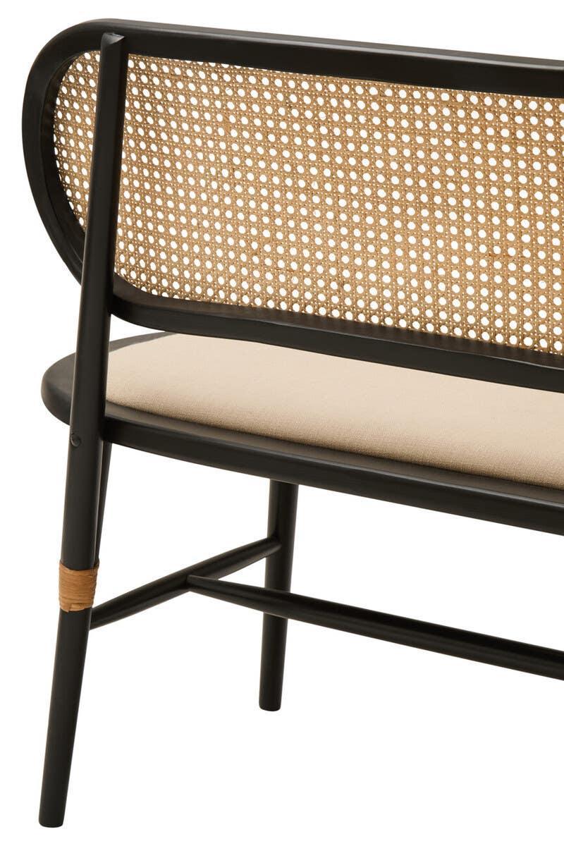 Rattan bench with black wood frame and beige upholstered seat, close-up of backrest