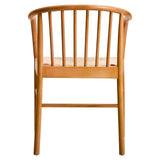 Natural wood dining chair with curved spindle back and woven seat, rear view