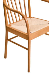 Solid wood dining chair with curved spindle back and woven seat detail