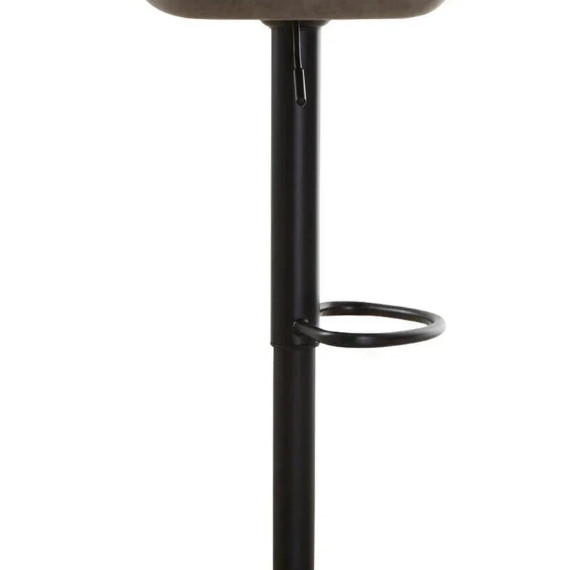 Brown faux leather bar stool with black pedestal base and built-in footrest, side view