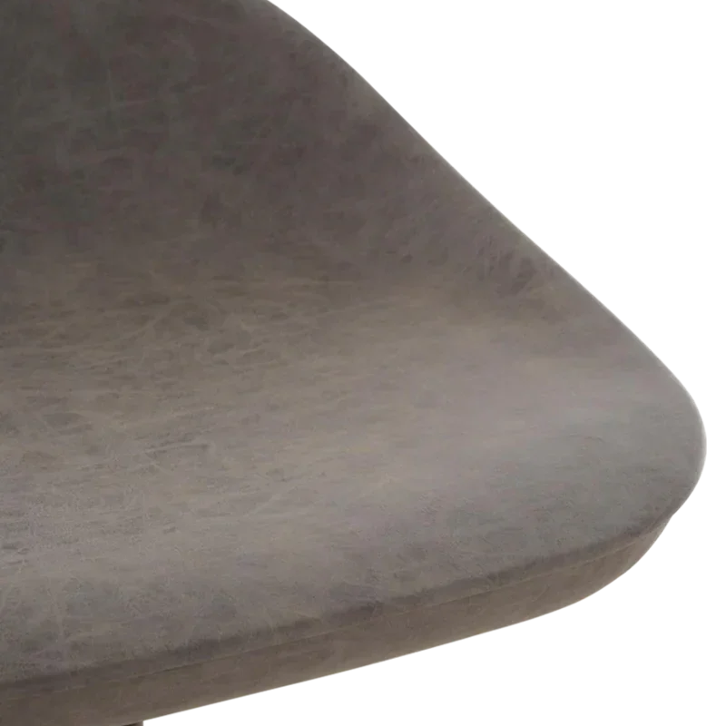 Close-up of grey faux leather dining chair seat with curved edge
