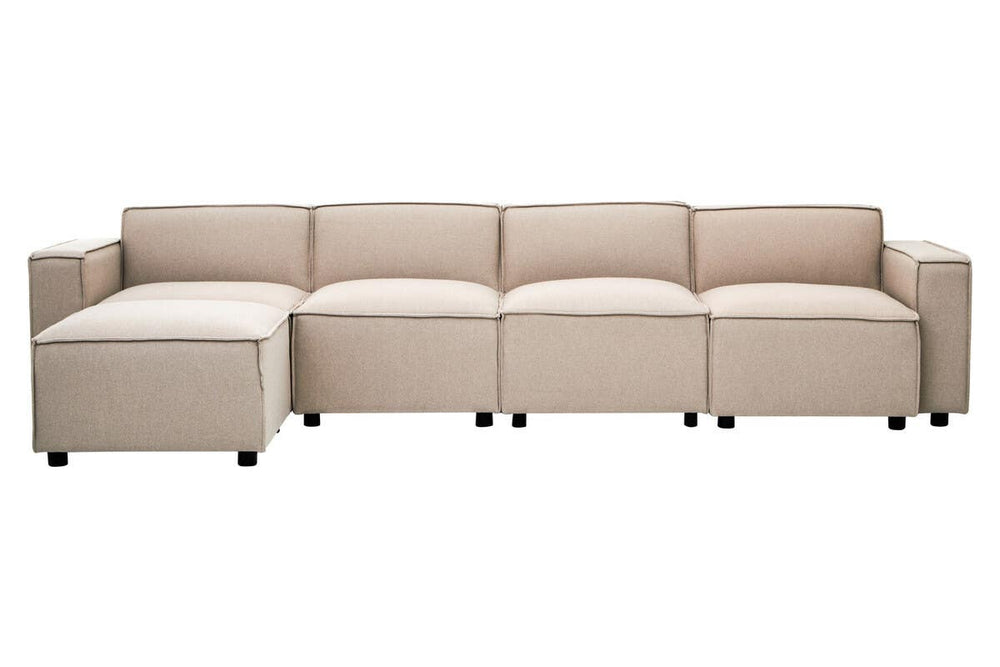 Armless modular sofa in a light natural fabric, featuring a contemporary design with clean lines and a low profile. The sofa consists of multiple sections, including a corner piece, and is supported by small black legs. The upholstery appears soft and inviting, suitable for modern living spaces