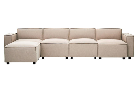 Armless modular sofa in a light natural fabric, featuring a contemporary design with clean lines and a low profile. The sofa consists of multiple sections, including a corner piece, and is supported by small black legs. The upholstery appears soft and inviting, suitable for modern living spaces