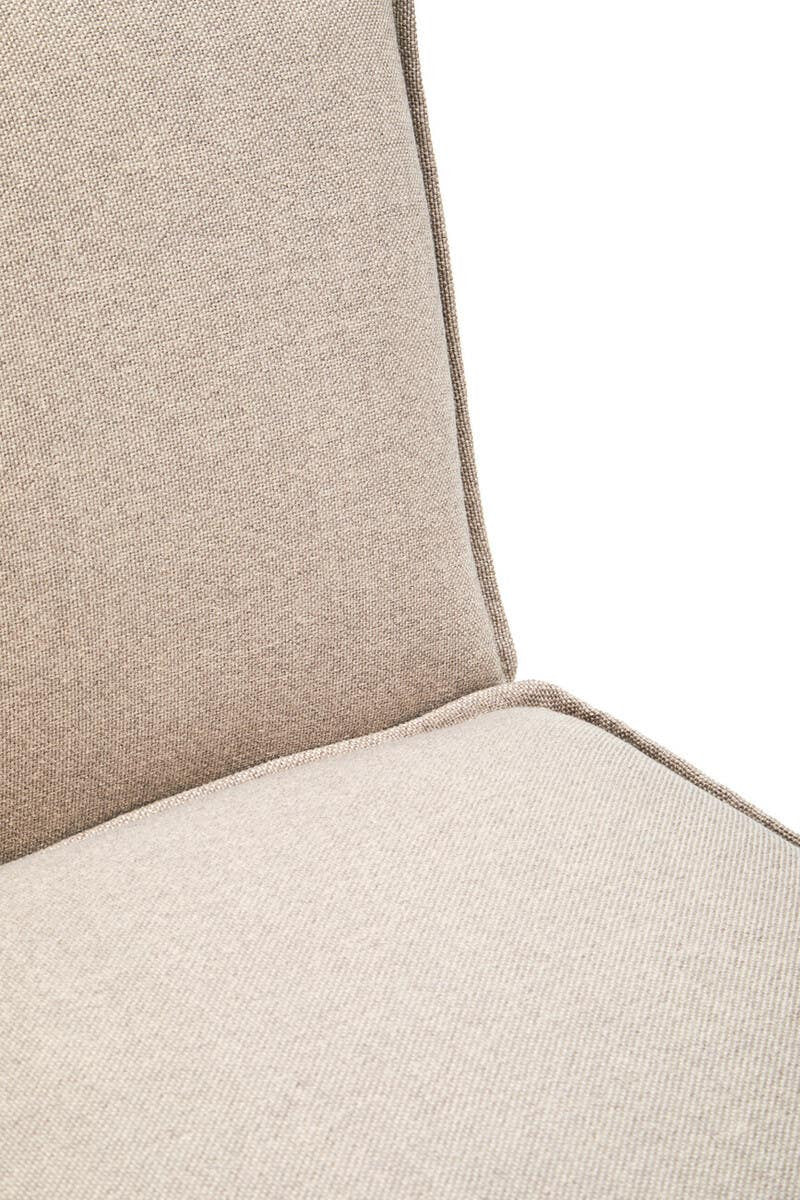 Close-up view of the Toulouse Natural Fabric Armless Modular Sofa, showcasing the soft beige fabric upholstery and clean lines of the backrest and seat cushion, highlighting the minimalist design and stitching details