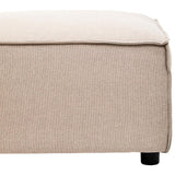 Natural fabric modular ottoman in a light beige color, featuring a clean, minimalist design with a soft, textured surface and rounded edges. The ottoman rests on small, dark wooden legs, providing stability and a modern touch