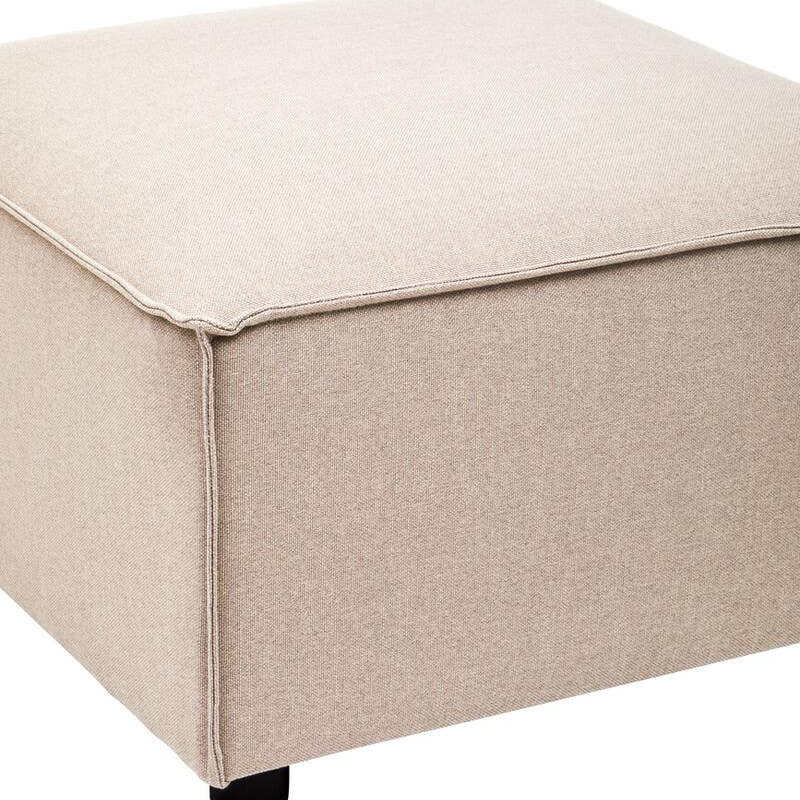 Square modular ottoman upholstered in natural fabric, featuring a soft, smooth surface and rounded corners. The ottoman rests on small black wheels for easy mobility
