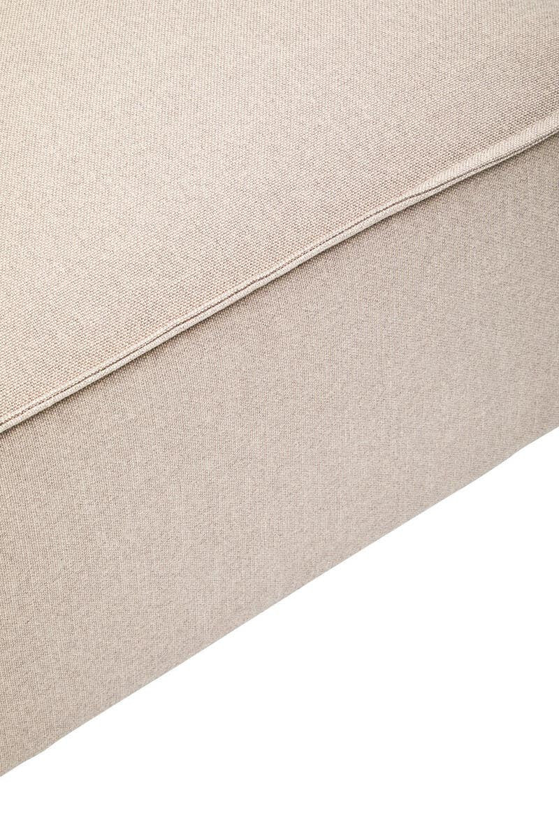 Natural fabric modular ottoman in a light beige color, featuring a smooth texture and clean lines, with a slightly rounded edge and a sturdy base