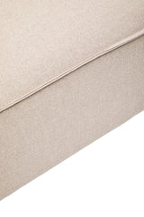 Natural fabric modular ottoman in a light beige color, featuring a smooth texture and clean lines, with a slightly rounded edge and a sturdy base
