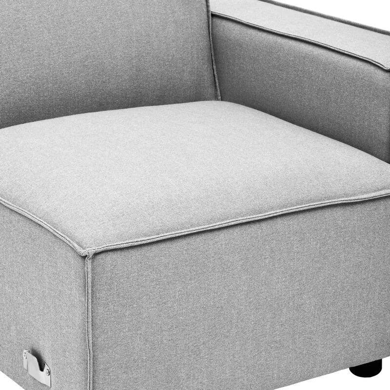 Grey fabric modular sofa section with a right arm, featuring a clean, modern design and a square seat. The sofa has a low backrest and is supported by small black legs. The upholstery appears soft and inviting, suitable for contemporary home decor
