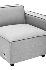 Grey fabric modular sofa section with a right arm, featuring a clean, modern design and a square seat. The sofa has a low backrest and is supported by small black legs. The upholstery appears soft and inviting, suitable for contemporary home decor
