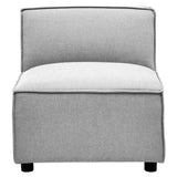 Armless modular sofa in a soft grey fabric with a clean, modern design, featuring a low backrest and a cushioned seat, supported by four black legs