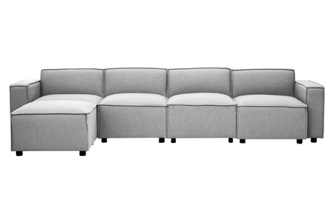 Grey fabric armless modular sofa featuring a contemporary design with clean lines, multiple sections, and a low profile. The sofa has a smooth texture and is supported by short, dark legs, making it suitable for modern living spaces