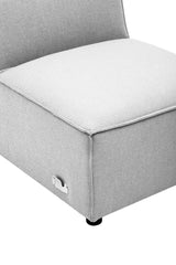 Armless modular sofa section in a soft grey fabric, featuring a plush white seat cushion and a sleek, minimalist design with rounded edges and small black feet