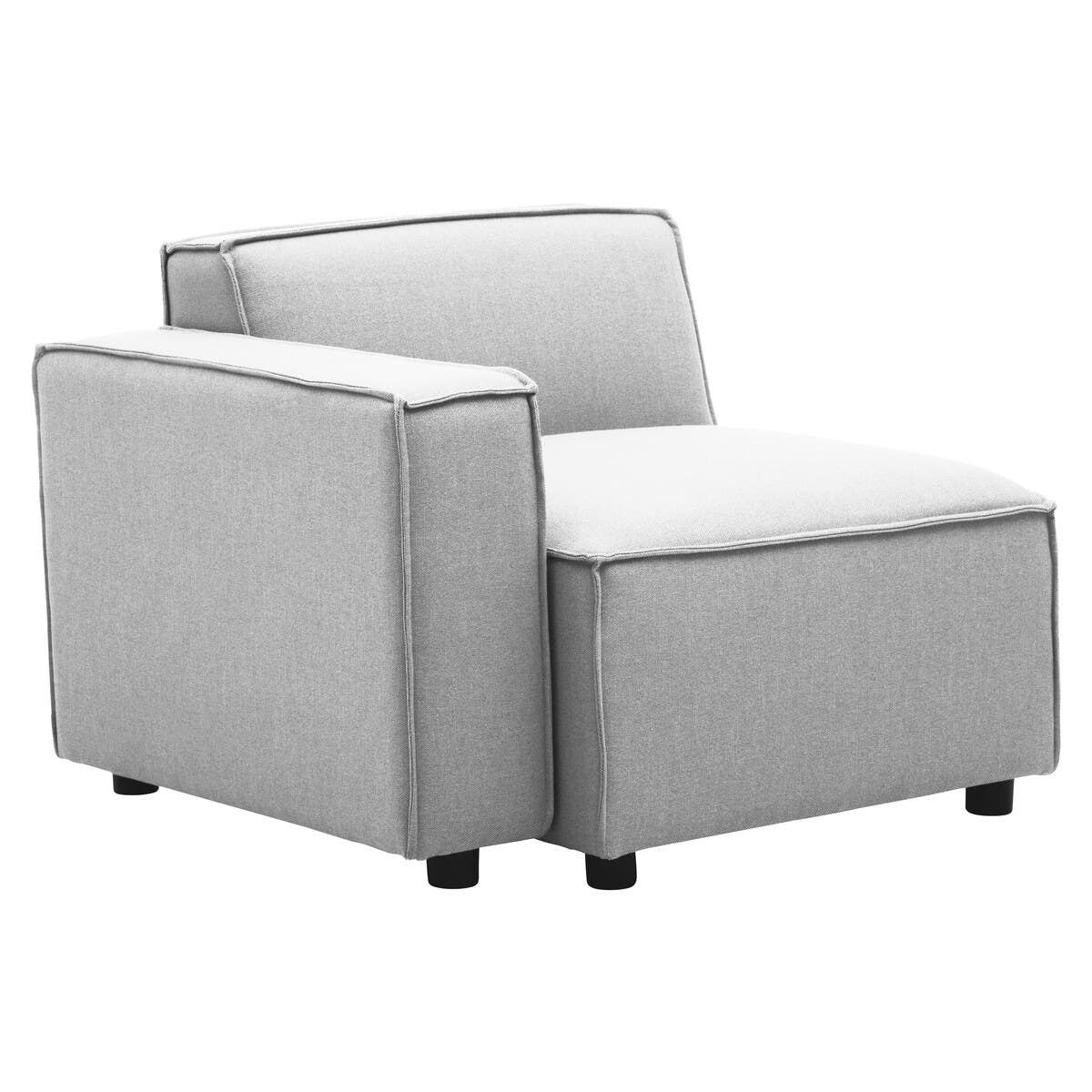 Left arm modular sofa in a soft grey fabric, featuring a minimalist design with a low back and wide seat cushion. The sofa has clean lines, square edges, and is supported by short black legs