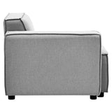 Left arm of a modular sofa upholstered in grey fabric, featuring a clean, modern design with a straight back and armrest. The sofa has a minimalist aesthetic with visible stitching details and sits on short, sturdy legs