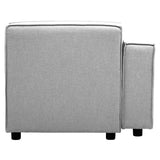 Left arm modular sofa in a soft grey fabric, featuring a clean, modern design with a low back and armrest. The sofa is supported by short, dark wooden legs, giving it a contemporary look. The upholstery appears smooth and inviting, suitable for various interior styles