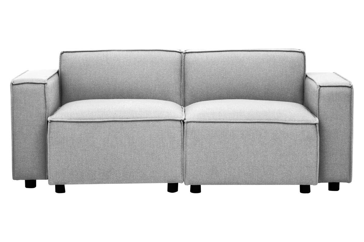 Left arm modular sofa upholstered in grey fabric, featuring two spacious seat cushions and two back cushions. The sofa has square armrests and sits on small black legs, showcasing a modern and minimalist design