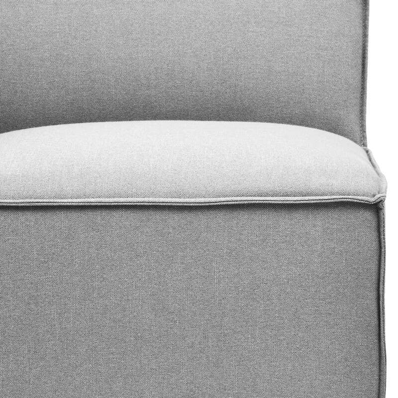 Left arm section of a modular sofa upholstered in light grey fabric, featuring a smooth, cushioned seat and a slightly curved backrest. The base is solid and includes small black feet for stability