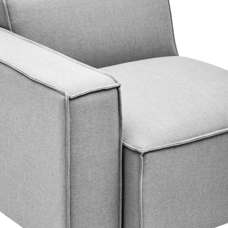 Left arm modular sofa in a soft grey fabric, featuring a clean, modern design with a low back and a wide seat cushion. The sofa has square arms and rests on small black legs, showcasing a minimalist aesthetic suitable for contemporary living spaces