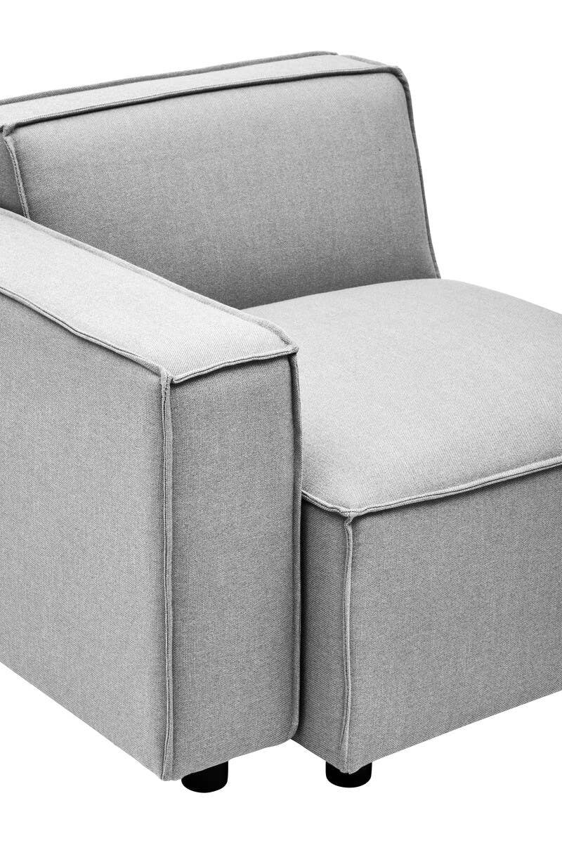 Left arm modular sofa in a soft grey fabric, featuring a clean, modern design with a low back and a wide seat cushion. The sofa has square arms and rests on small black legs, showcasing a minimalist aesthetic suitable for contemporary living spaces
