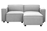 Grey fabric modular ottoman with a contemporary design, featuring two cushioned sections and square armrests. The ottoman is supported by small black legs, providing a modern touch to any living space