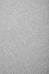Close-up view of a textured grey fabric, showcasing a soft, woven pattern suitable for a modular ottoman