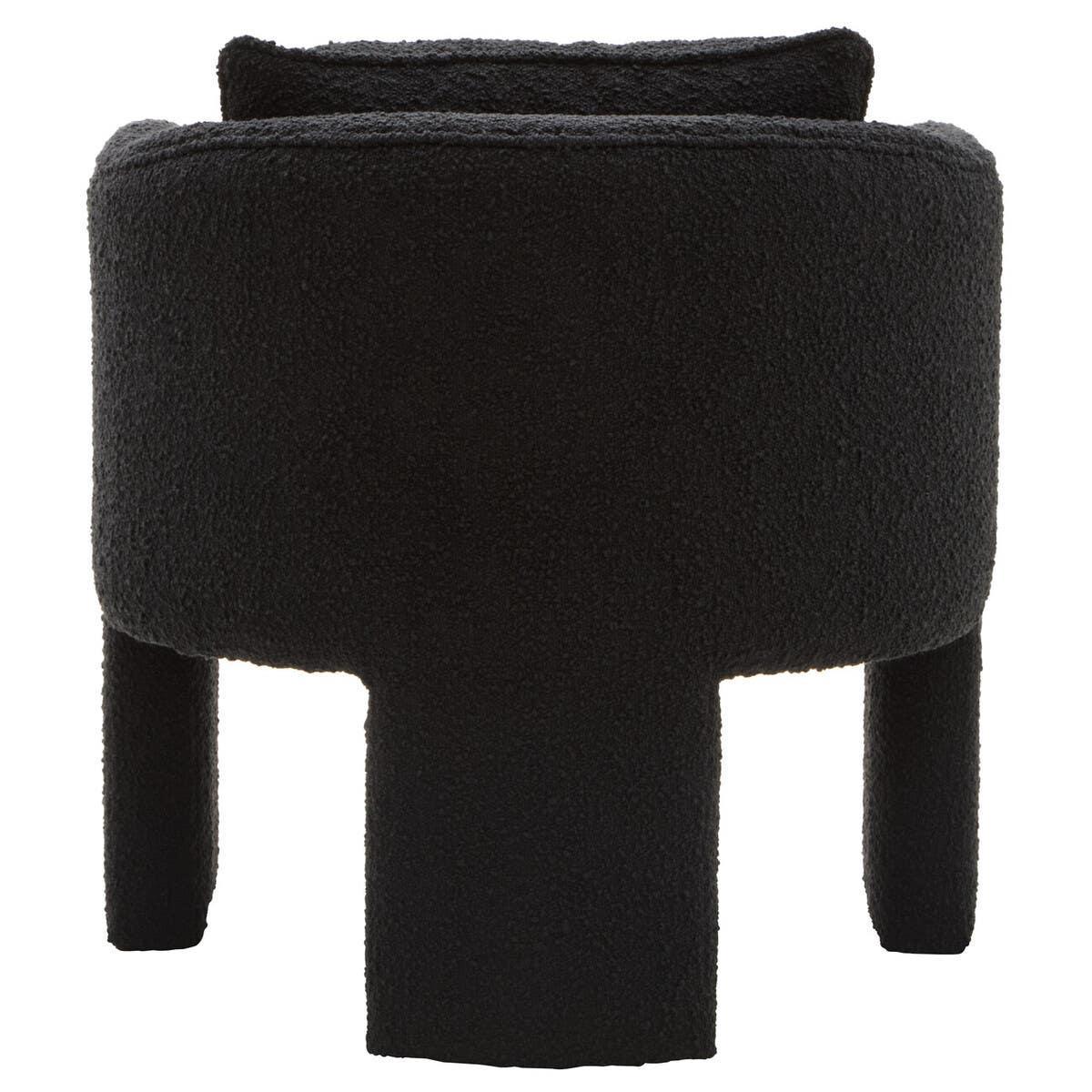 Black boucle accent chair with curved back and modern three-leg design from rear view